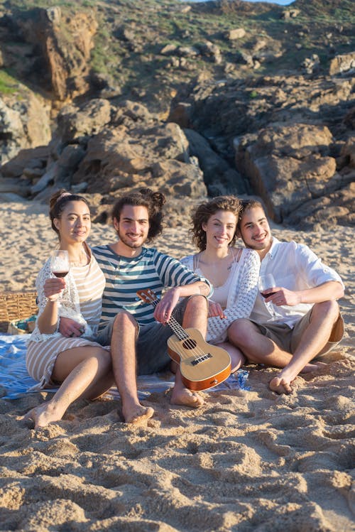 A Group of Friends Sitting on the Beach