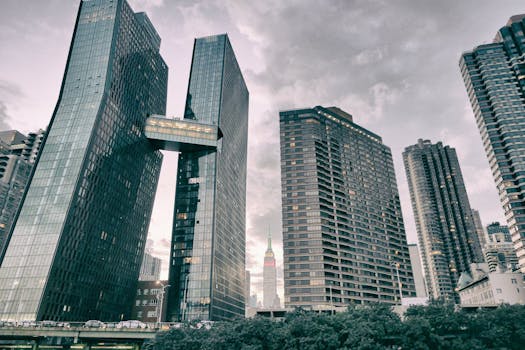 Stunning view of New York City skyscrapers under a cloudy sky, capturing the urban grandeur.