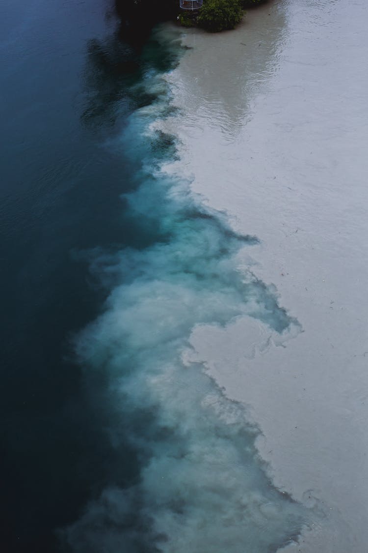 White Clouds Over Body Of Water