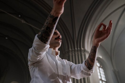 Tattooed conductor passionately leading a performance inside a grand cathedral with architectural details.