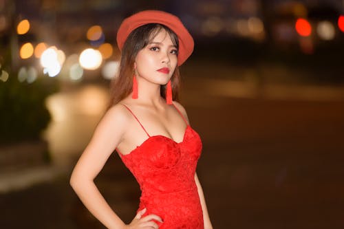 Photo of a Woman Wearing Red Dress 