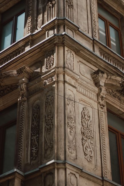 Close-up of intricate architectural design on a historic building facade showcasing elegant bas reliefs.