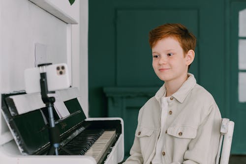 A Pianist Looking at His Phone