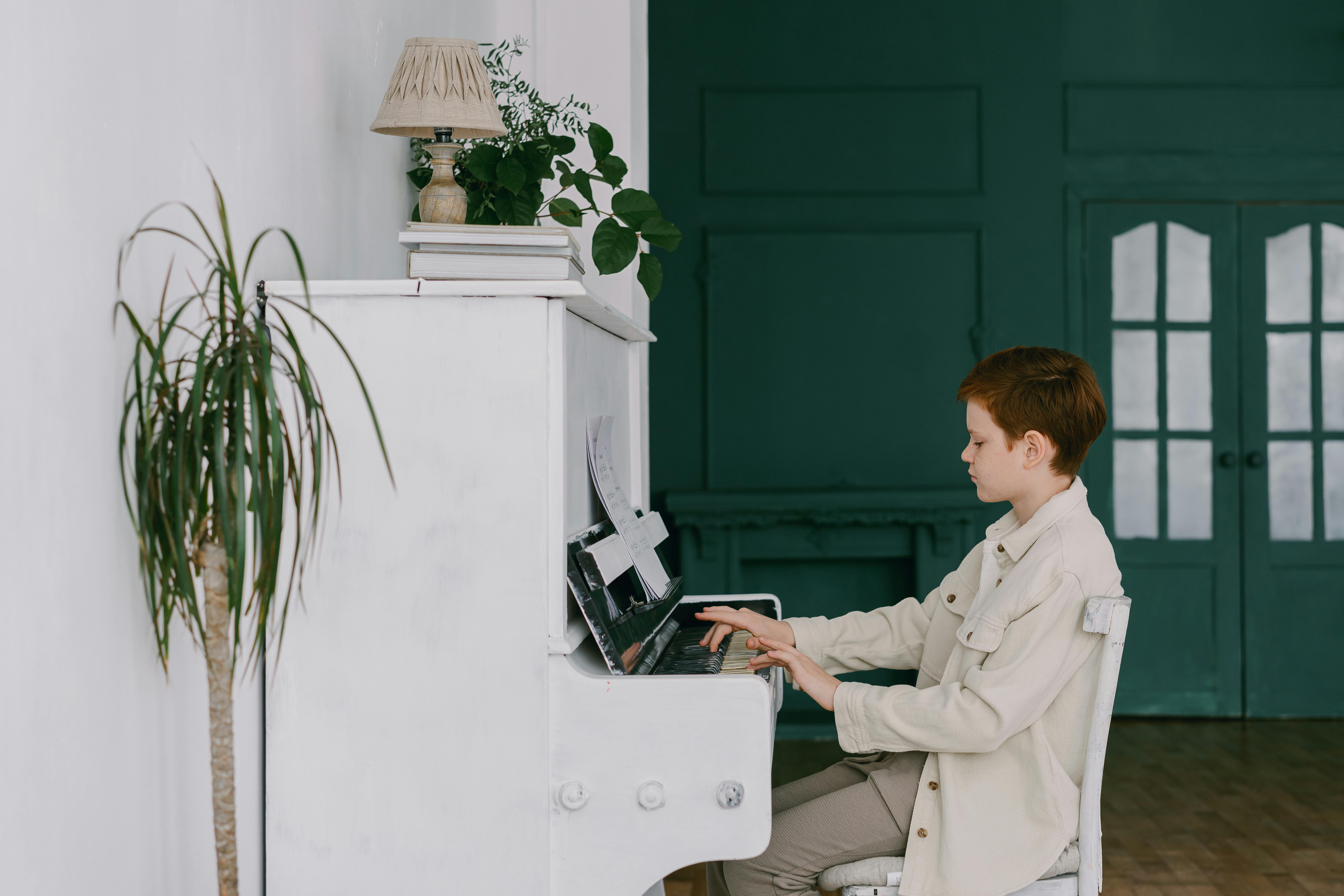 A Young Boy Playing Piano Free Stock Photo   Pexels Photo 7570116 