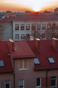 Captivating sunset view over urban rooftops in Kaliningrad, highlighting architectural beauty.