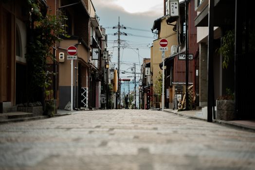 A tranquil view of a traditional street in Kyoto, Japan, showcasing the charm of local architecture.