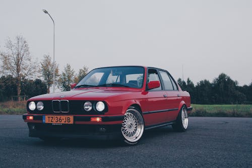 Free Photography of Red BMW On Asphalt Road Stock Photo