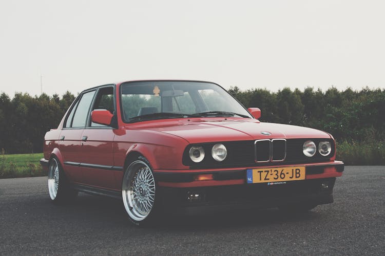 Photography Of Red BMW On Asphalt Road