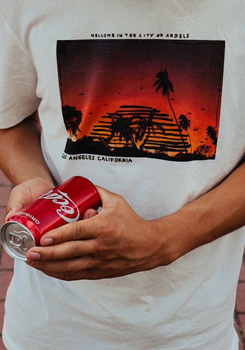 A Person Holding Coca Cola Can