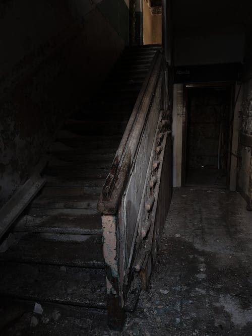 Staircase with handrail in abandoned bunt building