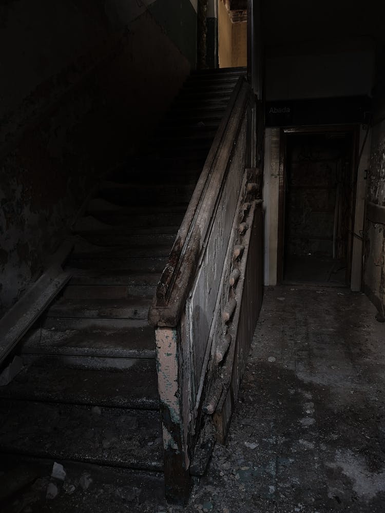 Staircase With Handrail In Abandoned Bunt Building