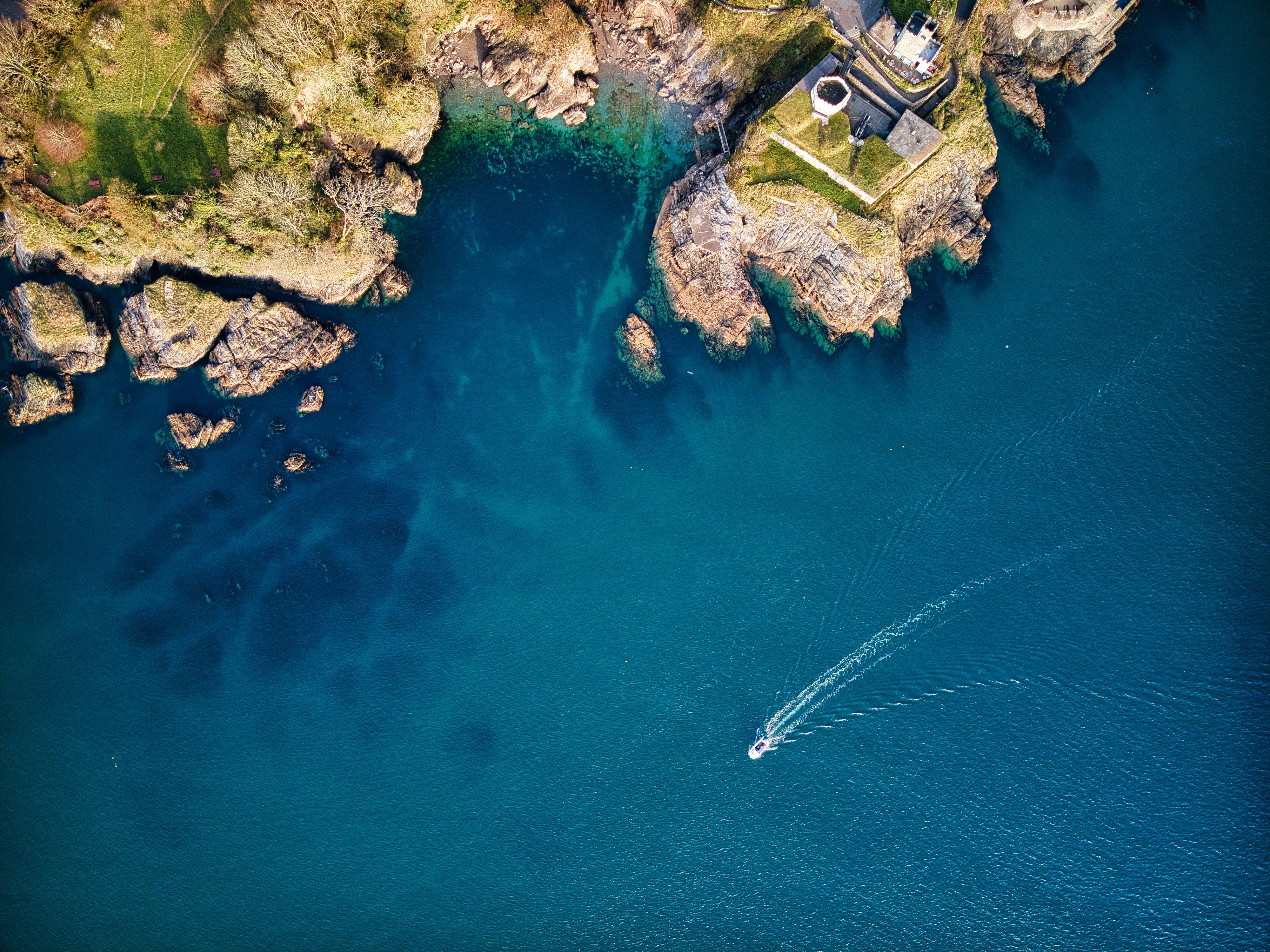 Aerial Shot of a Boat Sailing on the Sea · Free Stock Photo