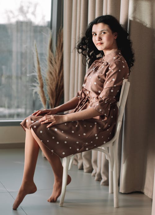 A Woman in a Polka Dot Dress