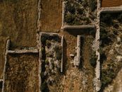 Drone shot of historical ruins and stone walls in Siggiewi, Malta.