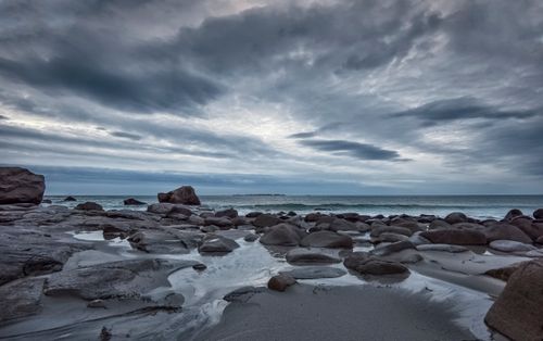 Free Explore the dramatic rocky seashore in Nordland, Norway under a cloudy sky. Stock Photo