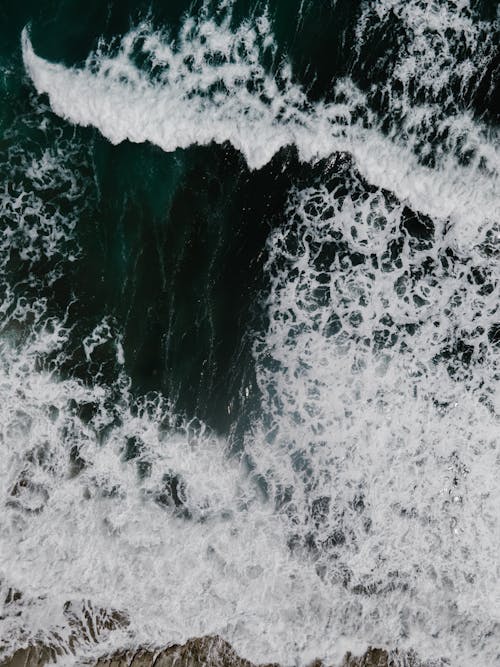 Top View of Sea Waves Crashing on Shore