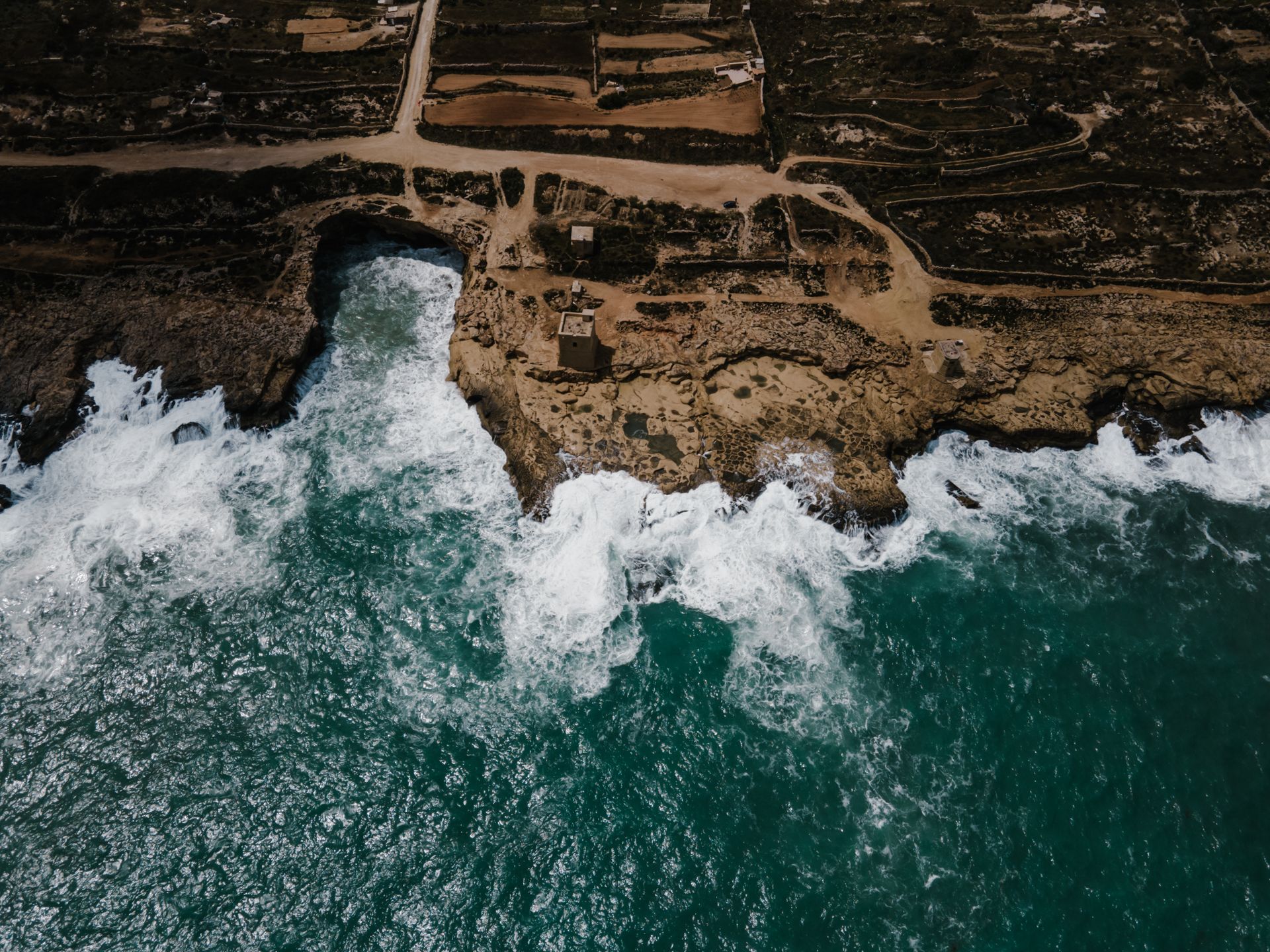 Aerial Shot of Ocean Waves Crashing on the Shore