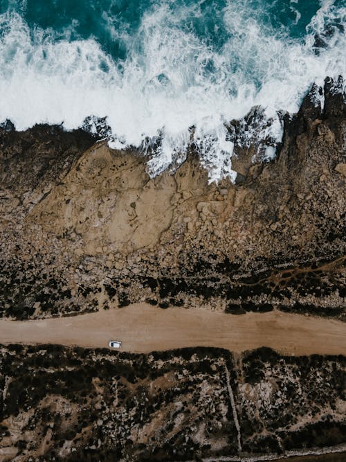 Overhead Shot of Sea Waves Crashing on the Shore