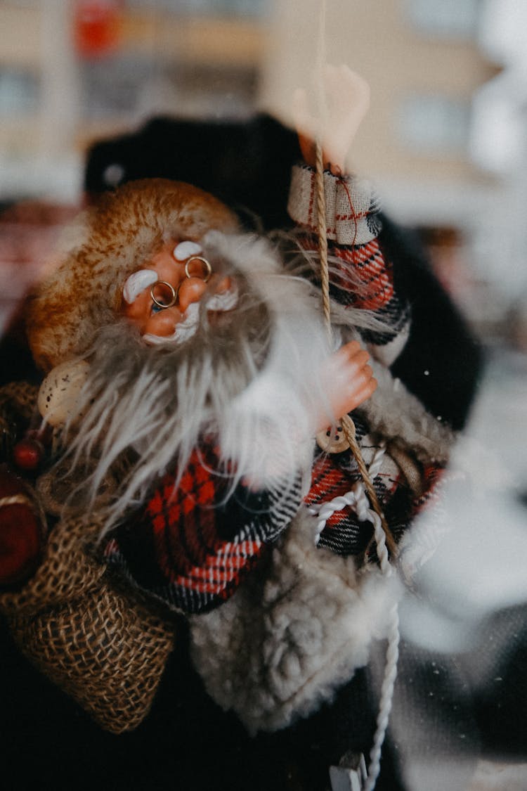 Santa Claus With Rope Near Window