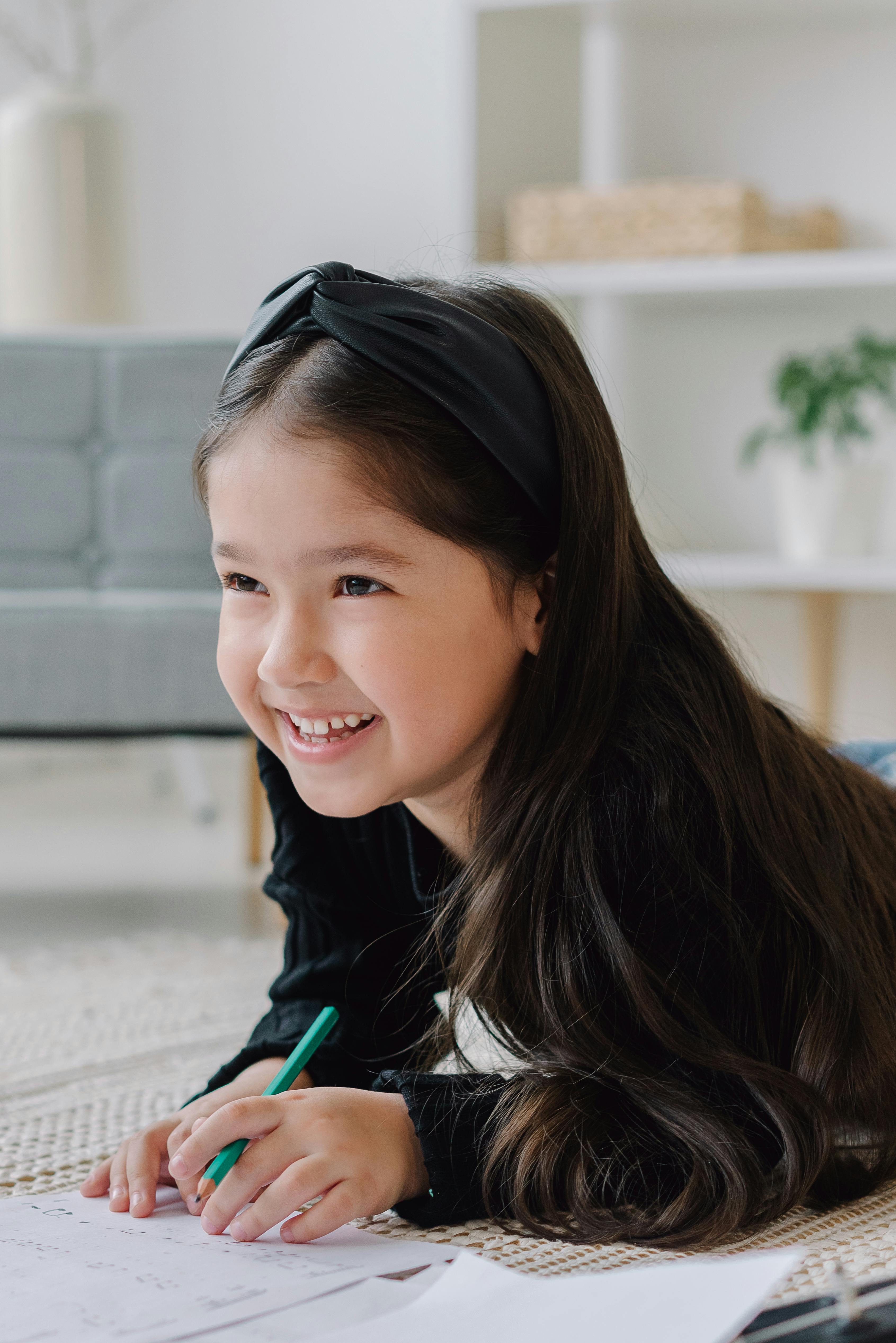Girl in White and Black Shirt Smiling