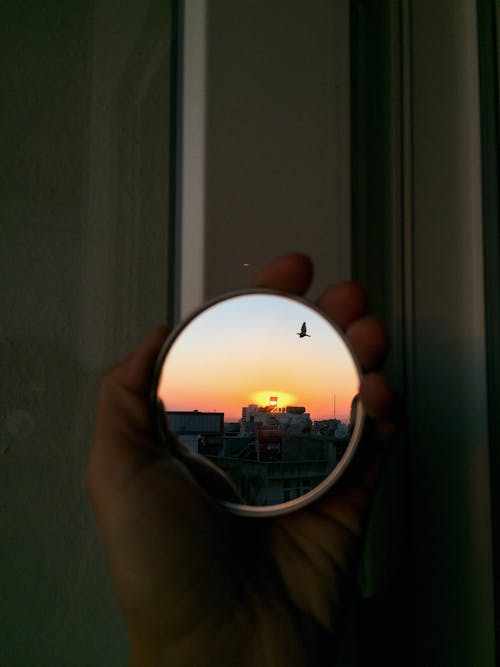 Sunset reflection on round mirror