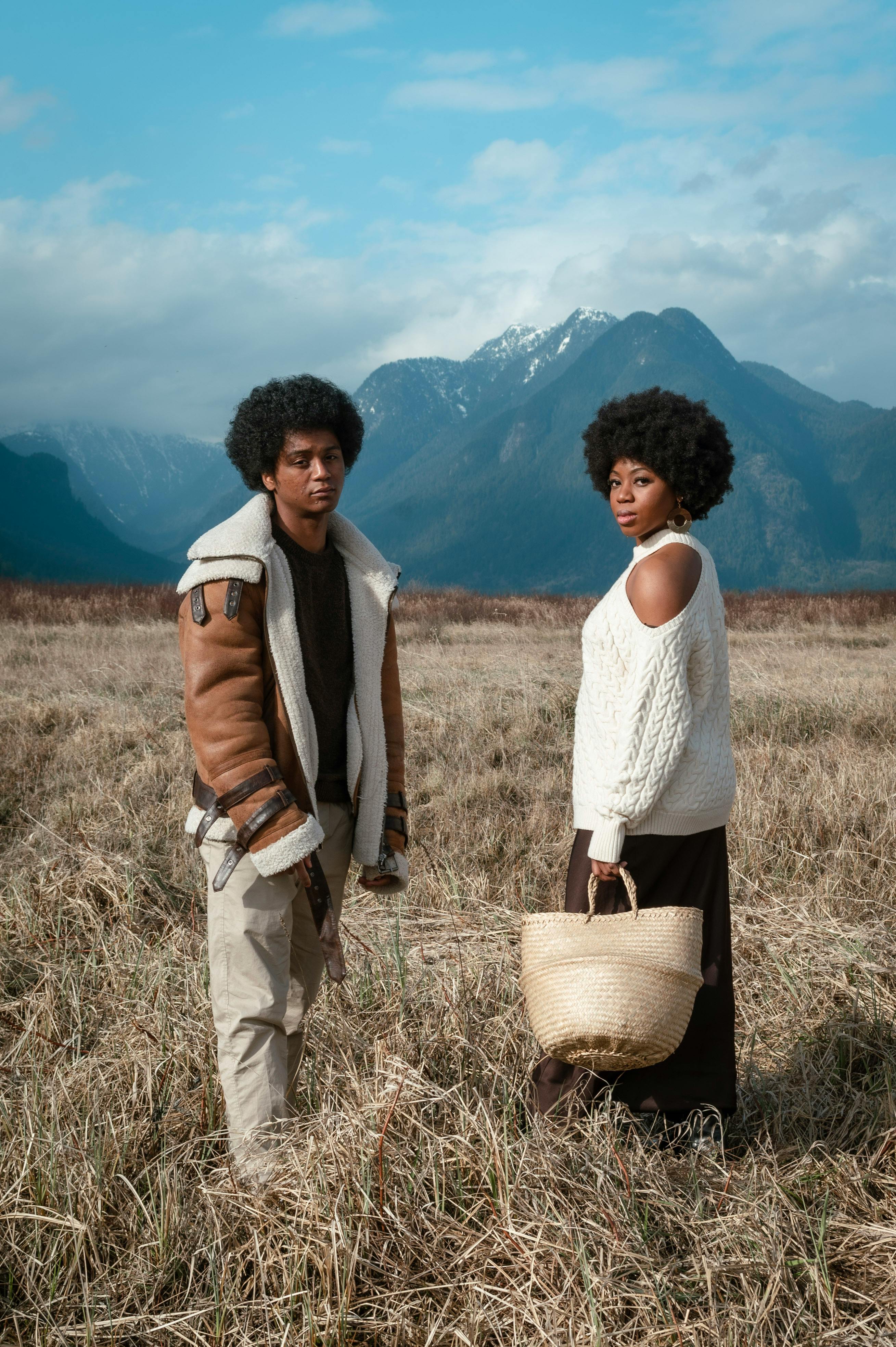 a man and a woman in an outdoor photoshoot