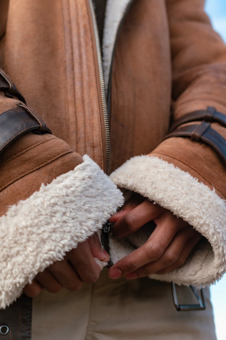 A Person In Brown Suede Jacket