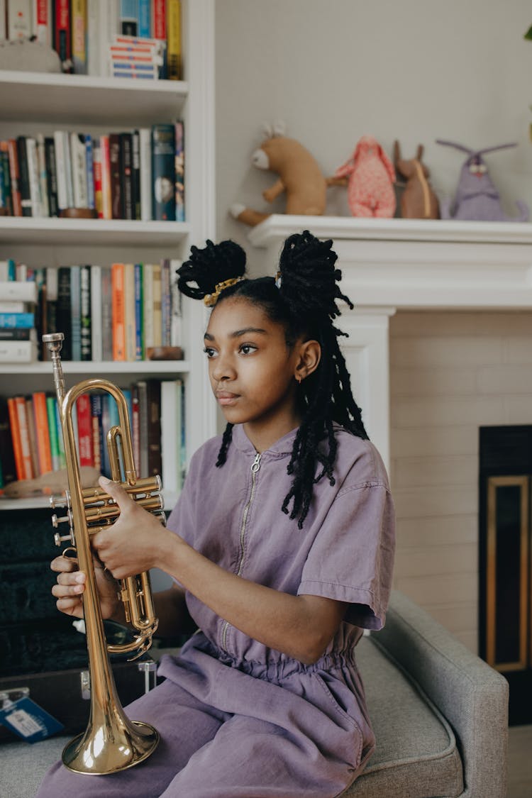 Girl Holding A Trumpet