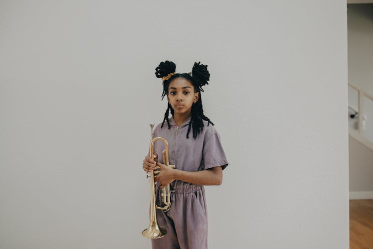 A Girl Holding Trumpet