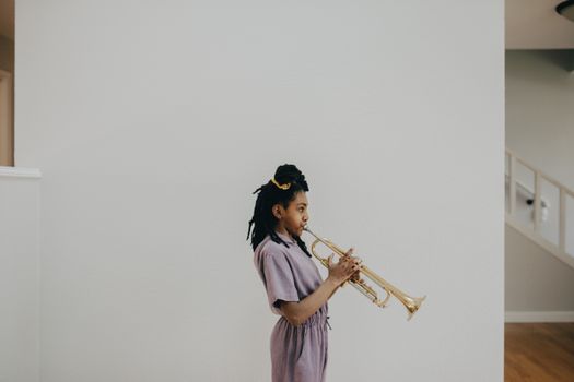 Photograph of a Girl Playing a Trumpet