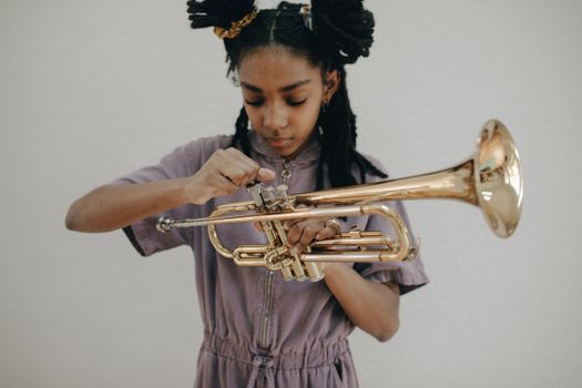 A Girl Holding a Trumpet