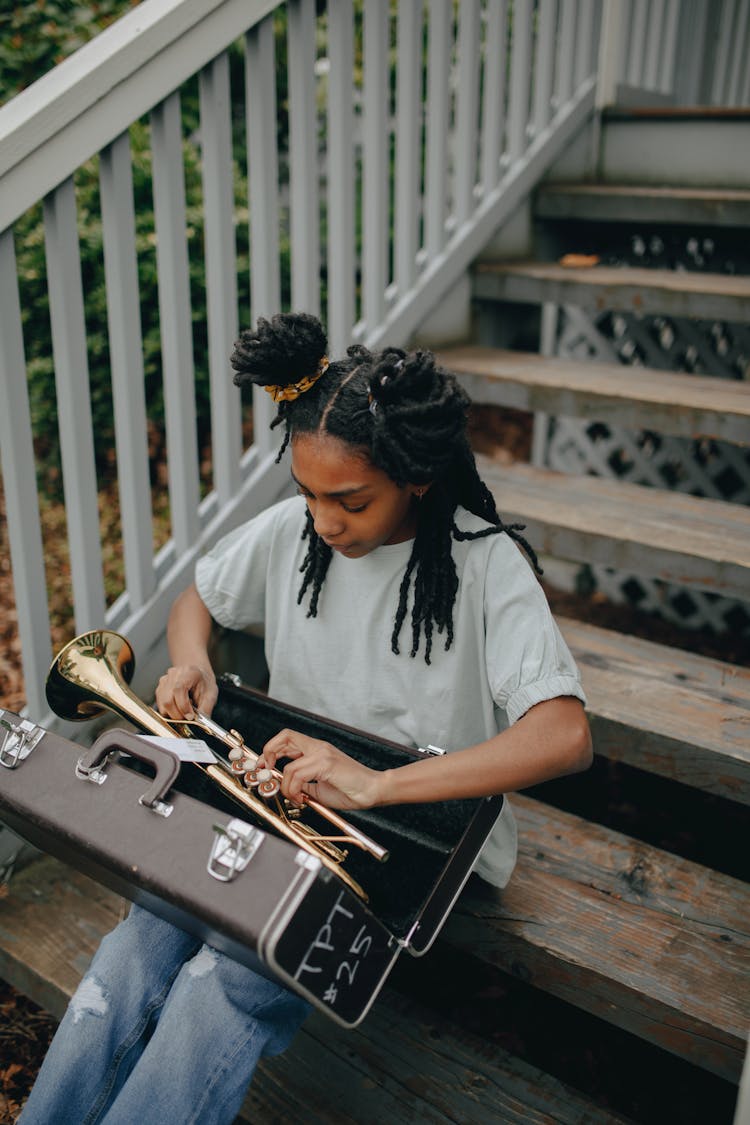 A Girl Looking The Trumpet