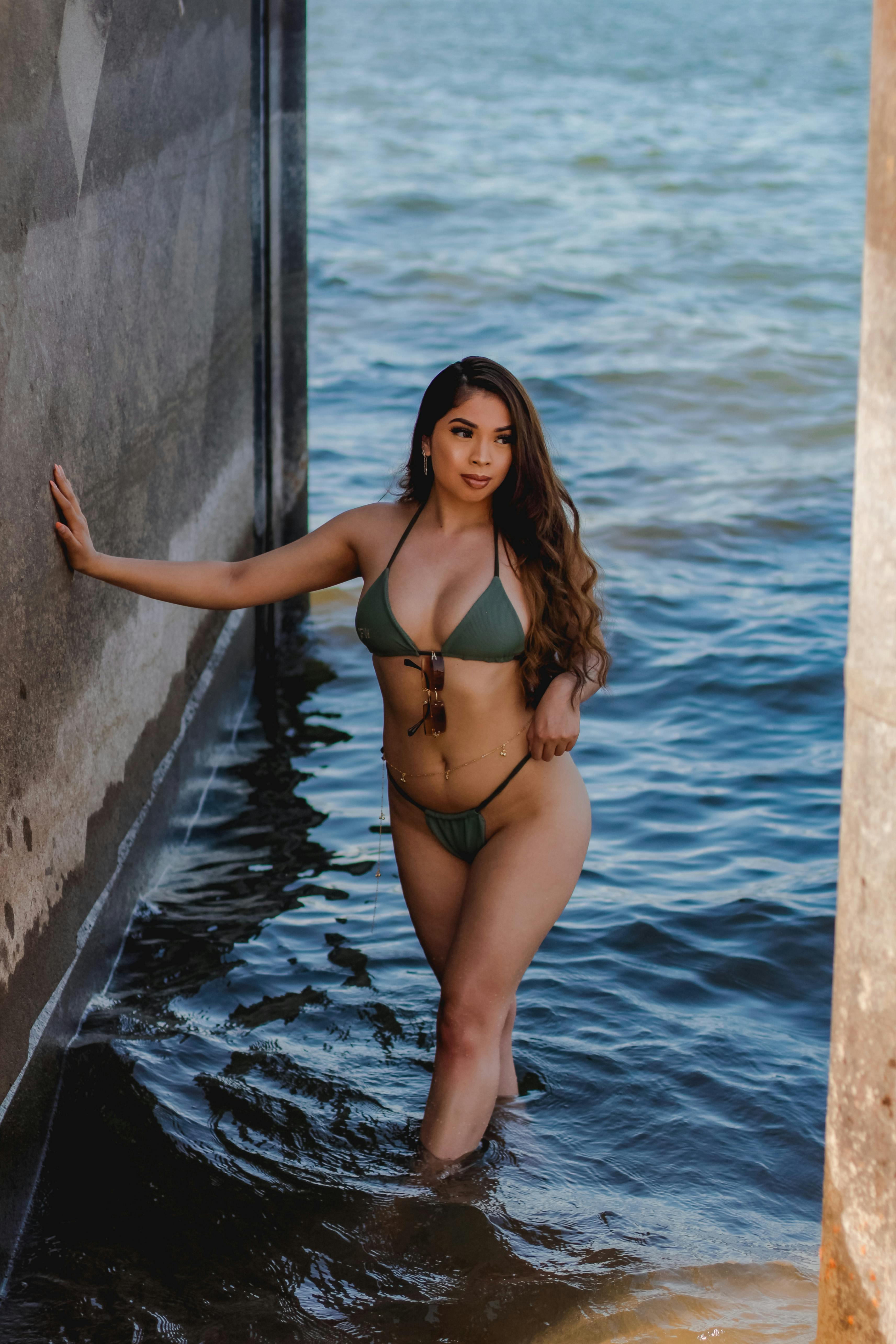 A Sexy Woman in Bikini Standing on Water · Free Stock Photo