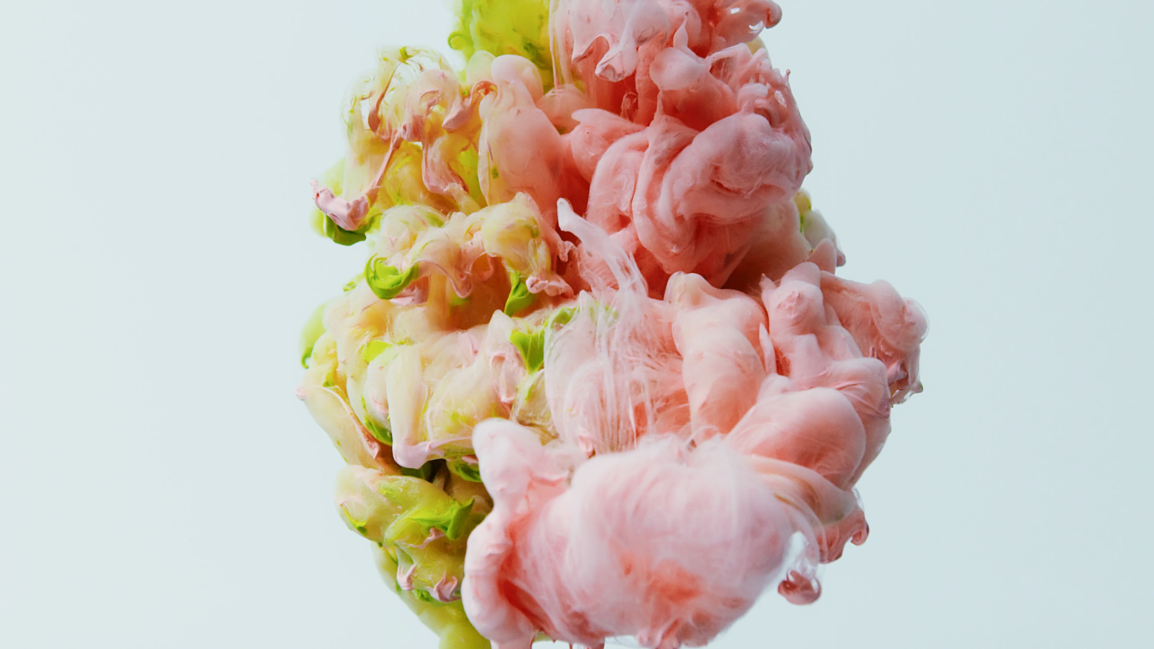 Fluffy pastel cloud bread being squished in slow motion with colorful background