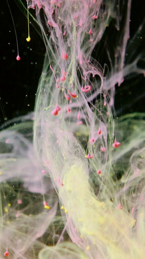 Free Vibrant abstract art showing dynamic pink and yellow fluid swirls on a dark backdrop. Stock Photo