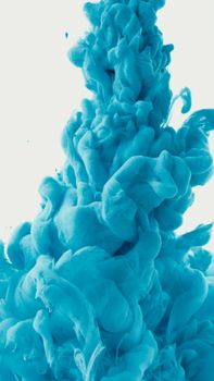 Abstract close-up of vibrant blue ink swirling underwater creating a dynamic, liquid art effect.