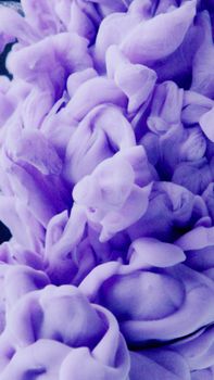 Abstract close-up of swirling purple ink creating ethereal patterns underwater. Captivating and dynamic visual texture.