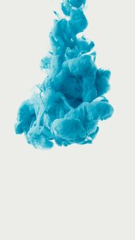Creative abstract art featuring a vibrant blue ink swirl underwater creating a mesmerizing pattern.