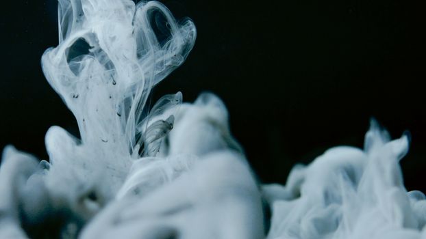Captivating abstract smoke swirl on a dark backdrop. Perfect for modern art and design enthusiasts.