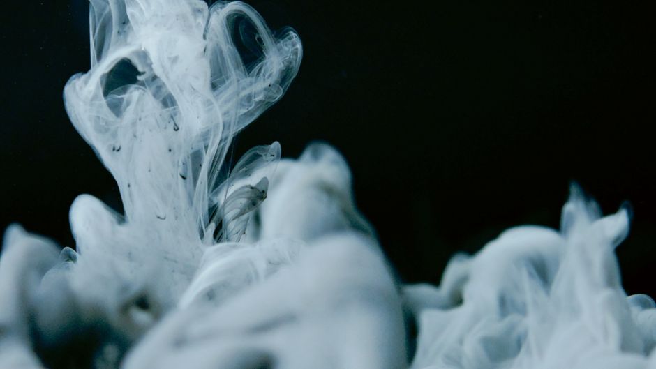 Captivating abstract smoke swirl on a dark backdrop. Perfect for modern art and design enthusiasts.