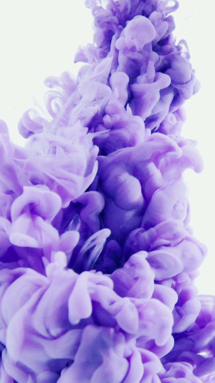 Close-up Shot Of A Purple Ink Underwater