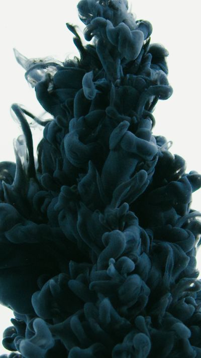 Ink dispersing in water, photo by Mart Production on Pexels