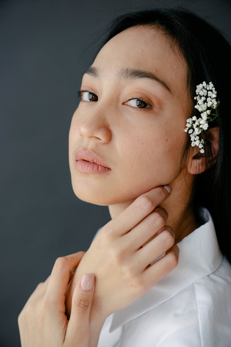 Attractive Asian Woman With Twig In Hand