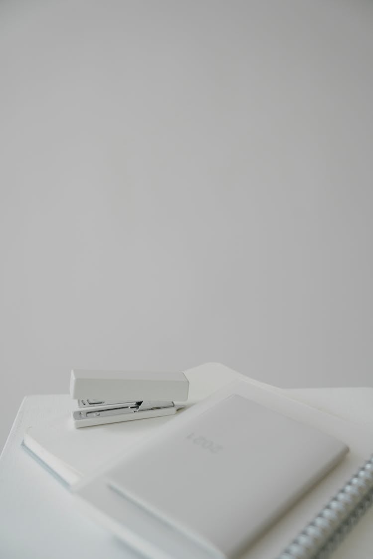 Table With Notebooks And Stapler