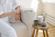 Crop person resting in cozy room