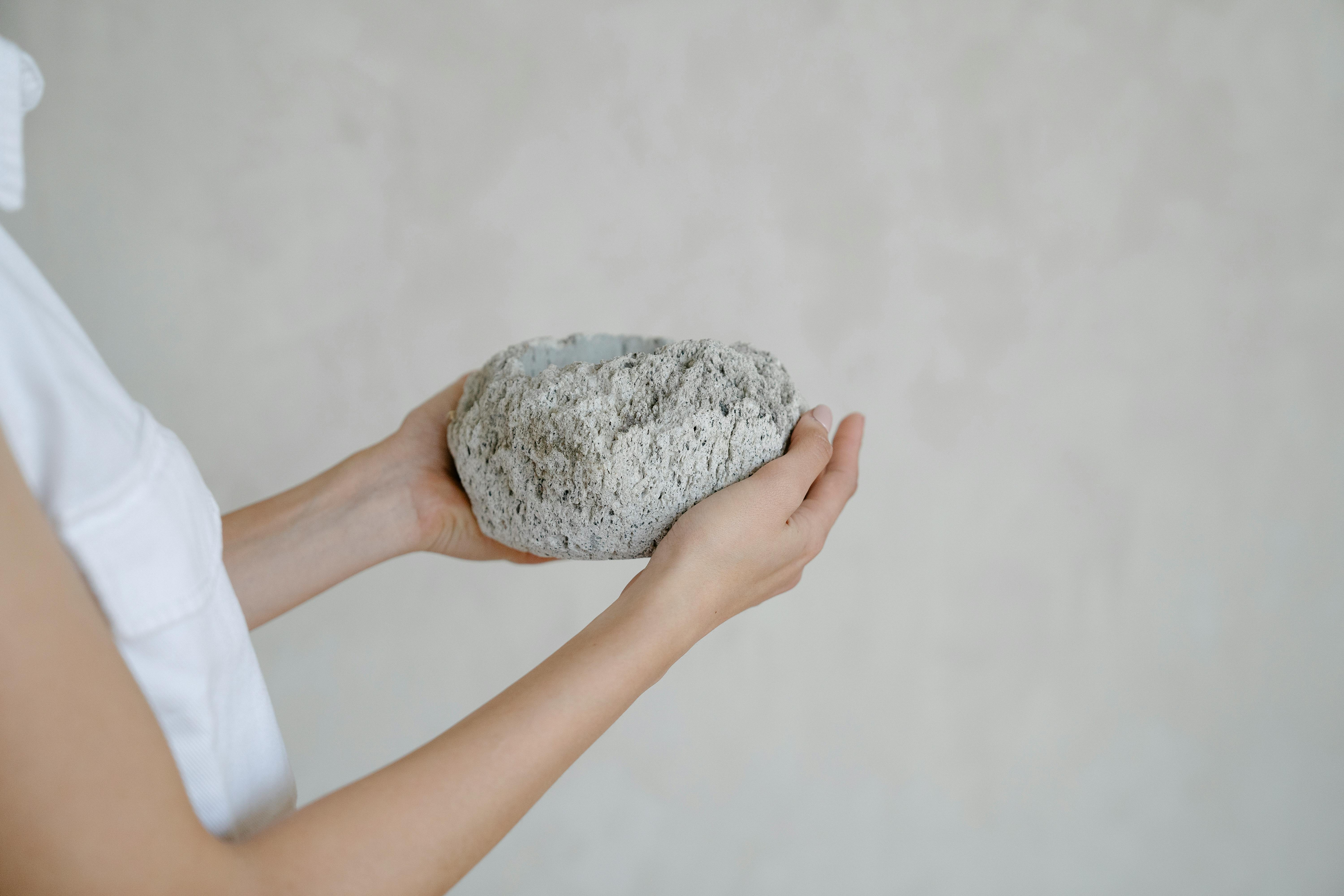 a person holding a rock