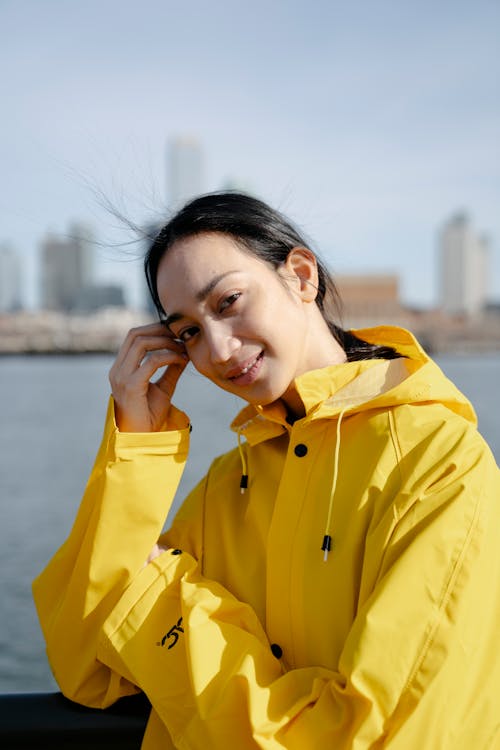 Photograph of a Woman in a Yellow Raincoat
