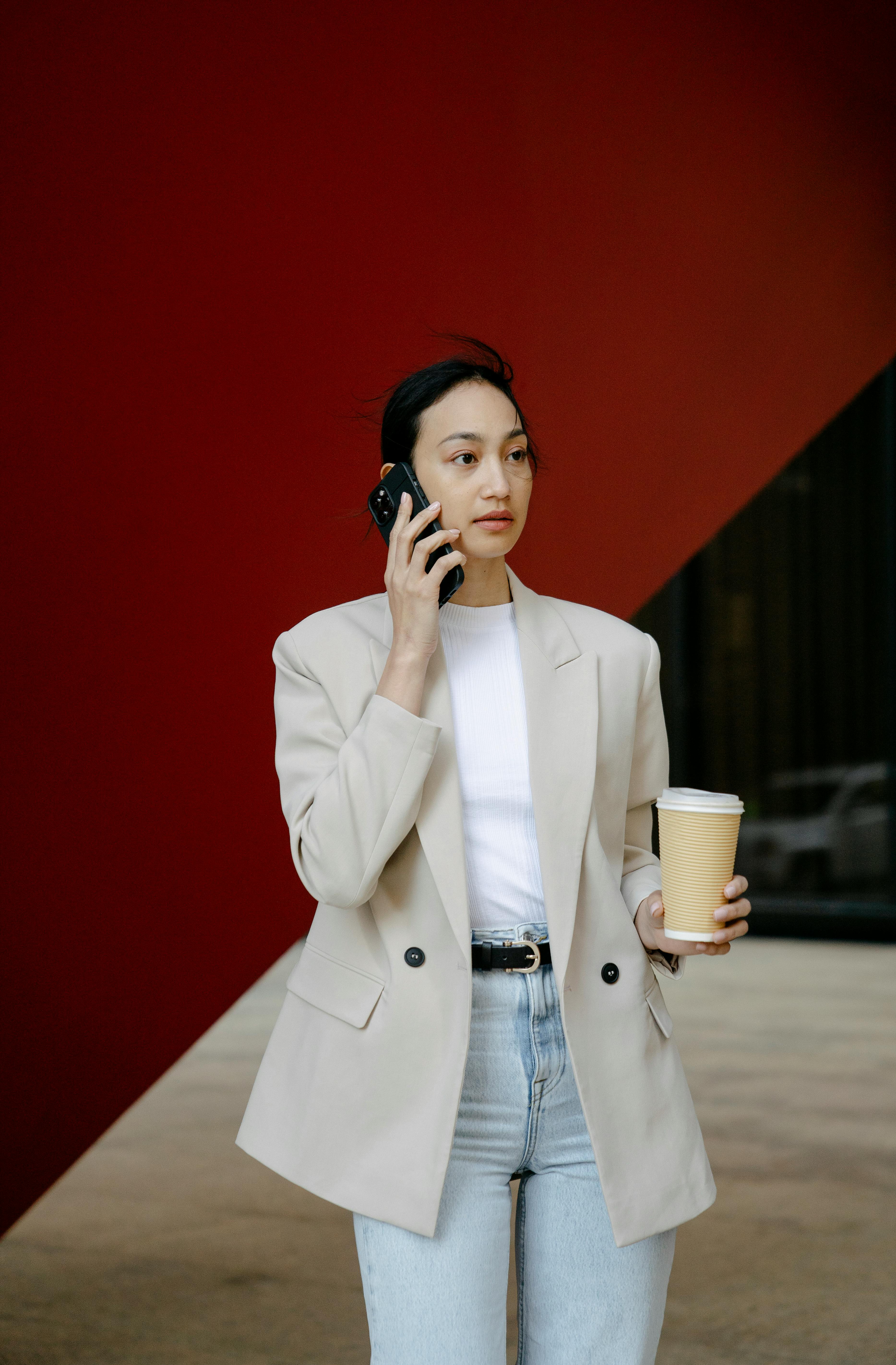 asian woman talking on smartphone in city