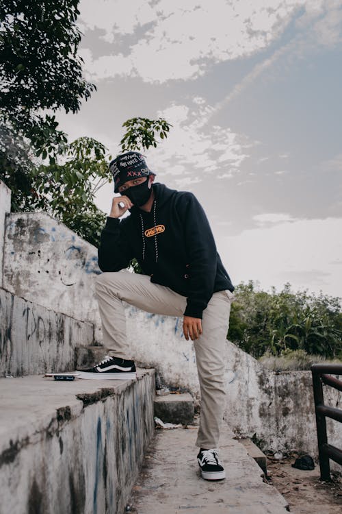 Man with a Black Face Mask Posing