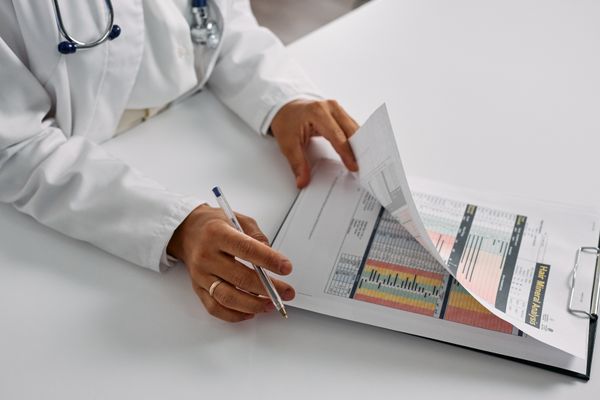 Home care professional assisting patient